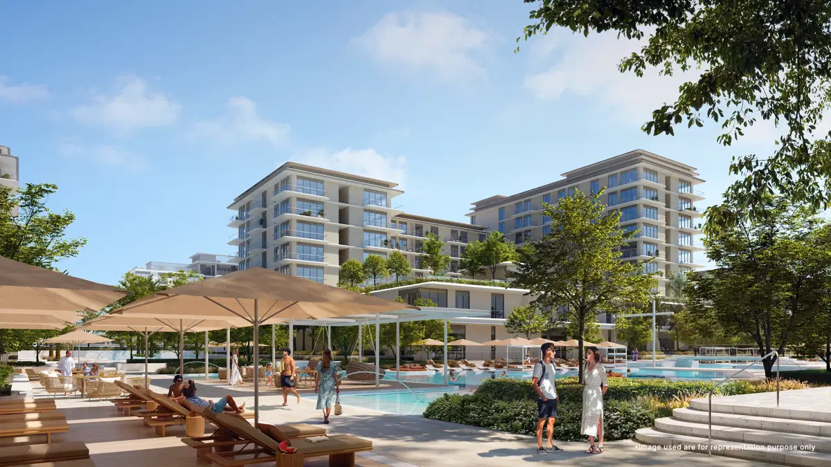 A vibrant and secured family pool zone with cabana seating and sunbath beds at Emaar Bayline