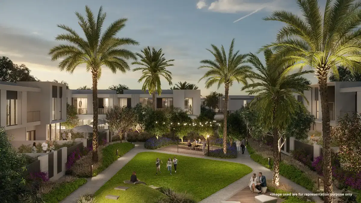 Children joyfully playing in the vibrant common garden zone at Emaar Talia The Valley, surrounded by greenery.